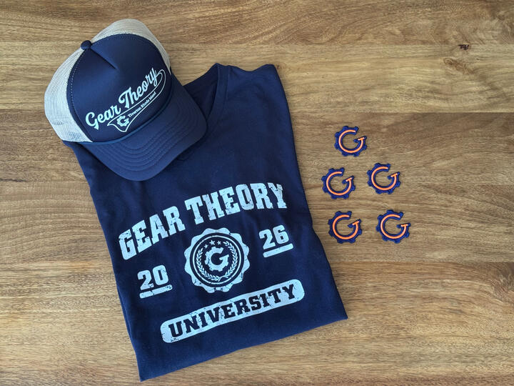 Navy Gear Theory shirt, matching cap, and colorful gear patches arranged on a wooden table.